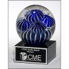 Art glass globe with blue and white sea anemone design on black glass base with felt bottom.