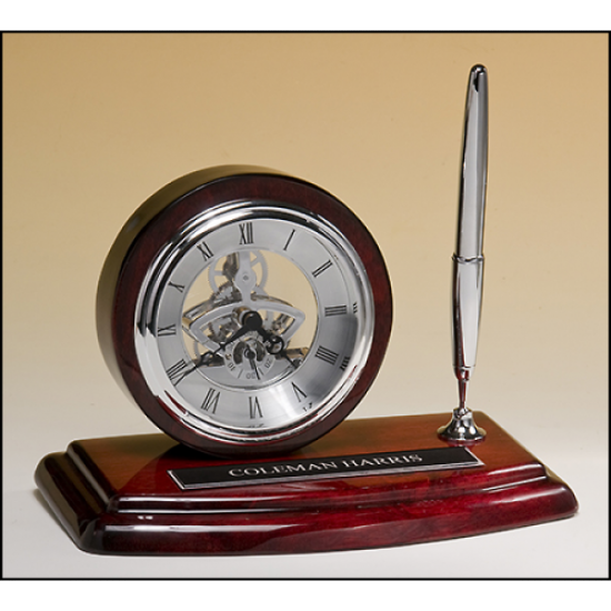 Skeleton clock, silver movement and pen with rosewood piano-finish case