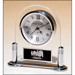 Desk clock with beveled glass upright and silver metal base, three hand clock movement