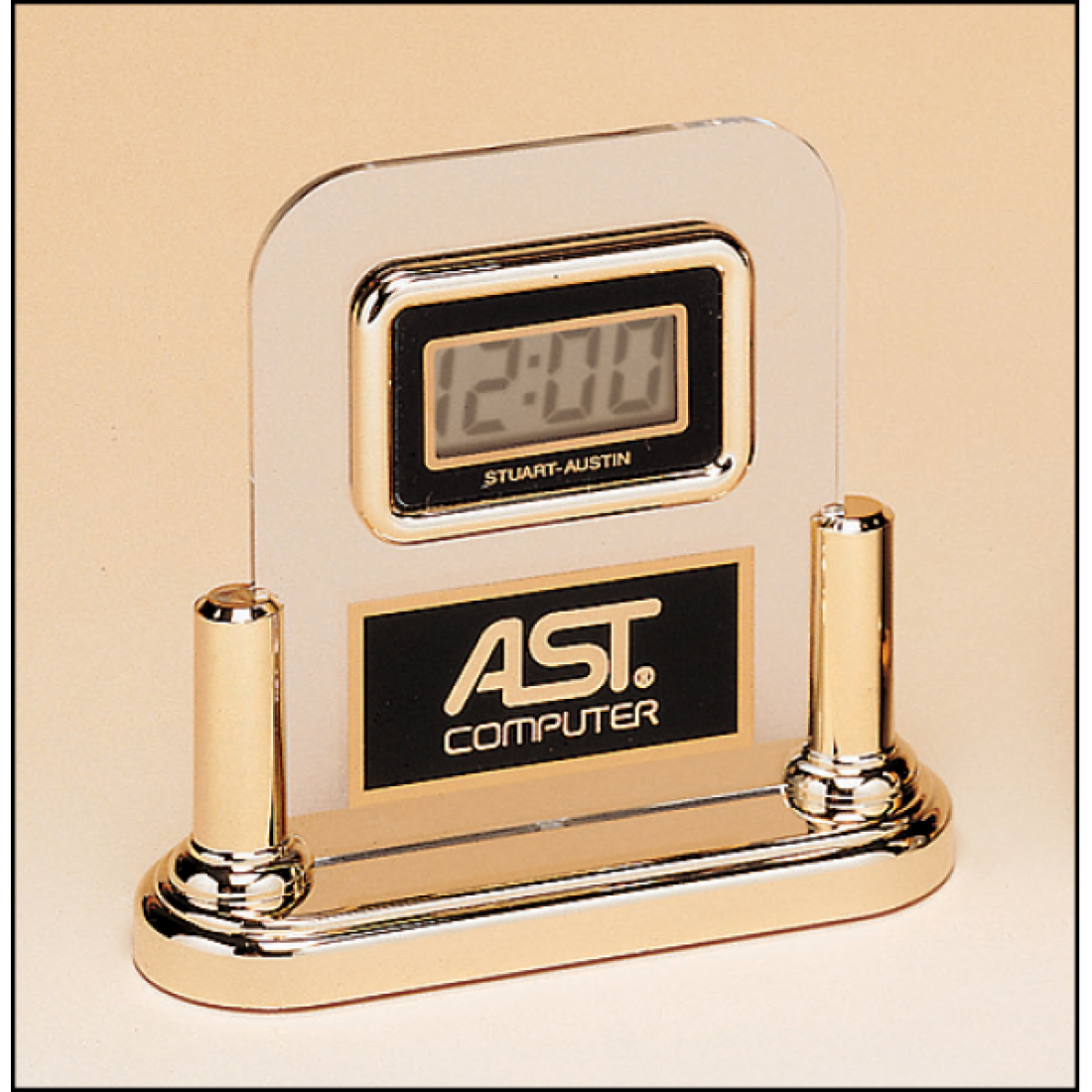 Acrylic Airflyte clock with LCD movement on a gold base.