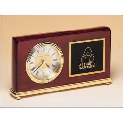 Rosewood stained piano finish Airflyte clock on a brass base.