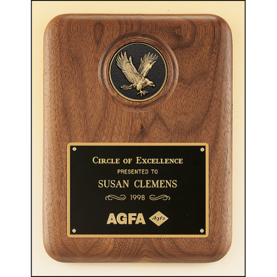 American walnut plaque with a finely detailed black and gold eagle medallion